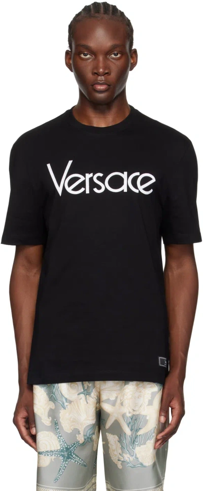 Versace Short-sleeve Cotton T-shirt With Bold Logo Print In Black
