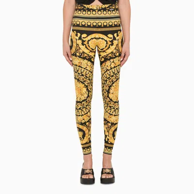 VERSACE VERSACE BLACK AND GOLD LEGGINGS WITH BAROQUE PRINT WOMEN