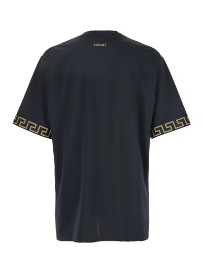 VERSACE BLACK CREWNECK T-SHIRT WITH GRECA PATTERN ON THE SLEEVES IN TECH FABRIC MAN