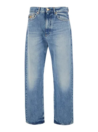 Versace Blue Jeans With Back Logo Patch And Faded Effect In Denim Man