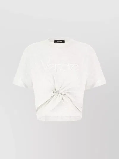 VERSACE COTTON T-SHIRT WITH CREW NECK AND DECORATIVE PIN