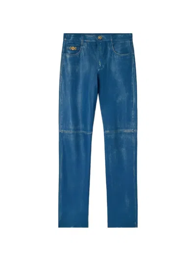 Versace Distressed-design Trousers In Blue