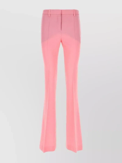 VERSACE EMBROIDERED WOOL PLEATED TROUSERS