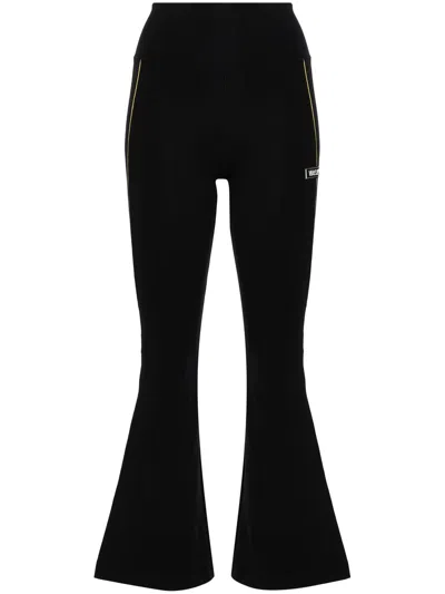 Versace Logo-appliqué Flared Leggings In Schwarz