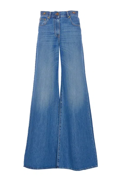 Versace Flared Medusa 95 Denim Trousers In Blue