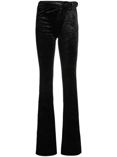 Versace Flared Low-rise Trousers In Black