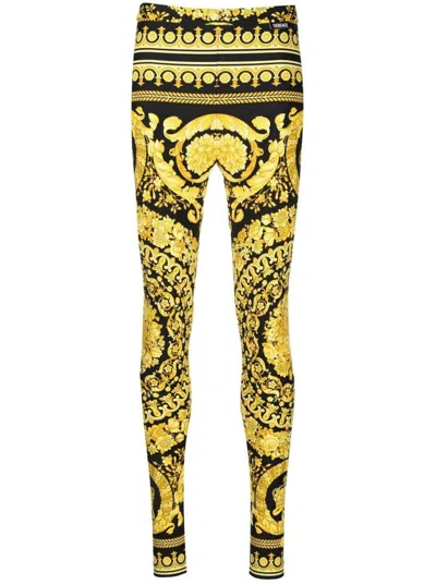 VERSACE GOLD AND BLACK STRETCH FABRIC LEGGINGS WITH BAROQUE HERIATGE PRINT VERSACE WOMAN