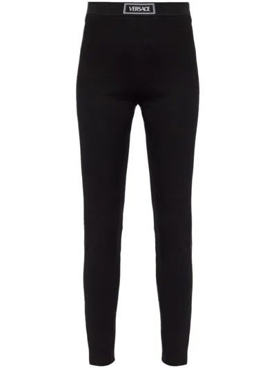 VERSACE HIGH-WAISTED SLIM FIT TROUSERS WITH BRANDED LABEL