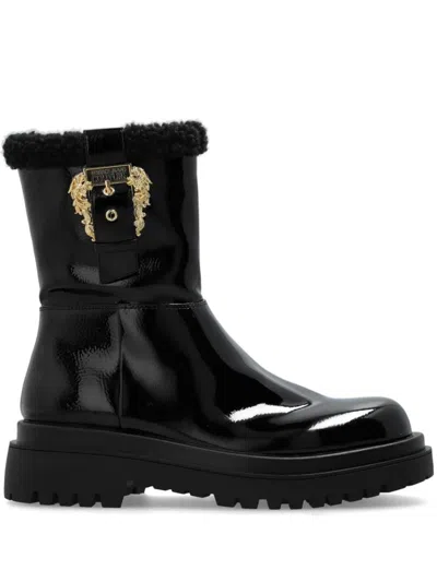 VERSACE JEANS COUTURE VERSACE JEANS COUTURE ANKLE BOOTS WITH PLUSH FUR TRIM AND STATEMENT HARDWARE DETAIL