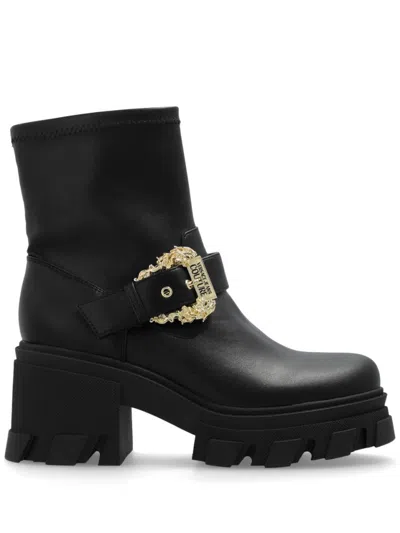 VERSACE JEANS COUTURE VERSACE JEANS COUTURE HEELED ANKLE BOOTS WITH DECORATIVE BUCKLE AND RUGGED SOLE