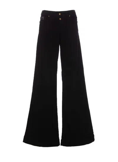 VERSACE JEANS COUTURE FLARE JEANS WITH LOGO DECORATIONS