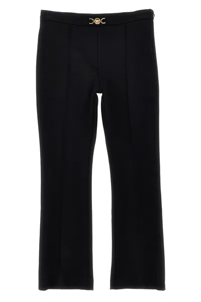 Versace Jersey Pants W/ Logo Buckle In Black