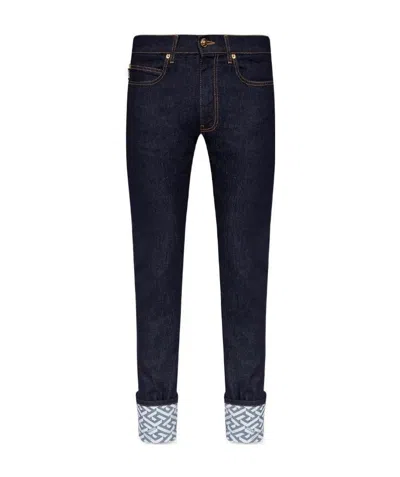 Versace La Greca Cuffed Jeans In Black