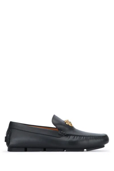 Versace Logo Plaque Leather Loafers In Black