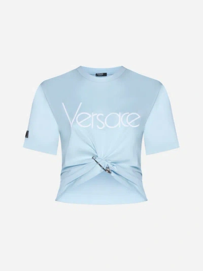 Versace Cropped Embellished Knotted Cotton-jersey T-shirt In Light Blue,white