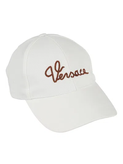 Versace Logo Embroidered Baseball Cap In White/tabacco