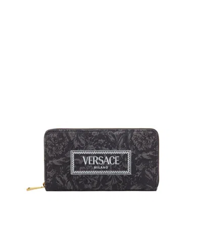 Versace Logo-embroidered Zip-up Wallet In Black