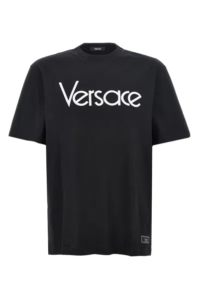 Versace Short-sleeve Cotton T-shirt With Bold Logo Print In Black