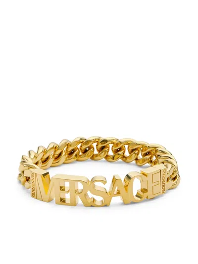 Versace Logo-lettering Polished-finish Bracelet In Gold | ModeSens