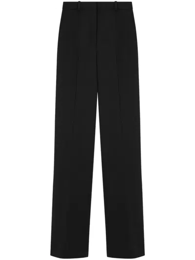 Versace Logo-patch Trousers In Black