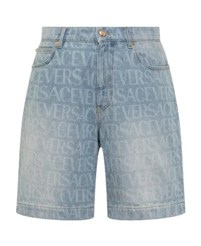 VERSACE VERSACE MID RISE LOGO PRINTED DENIM SHORTS