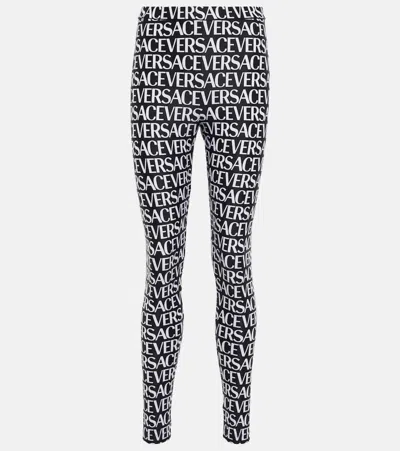 Versace All Over Logo Print Jersey Leggings In Black