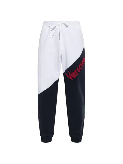 Versace Logo-embroidered Panelled Track Pants In Blue
