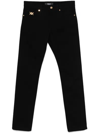 Versace Low-rise Straight Leg Jeans With Medusa Plaque Detail In Black