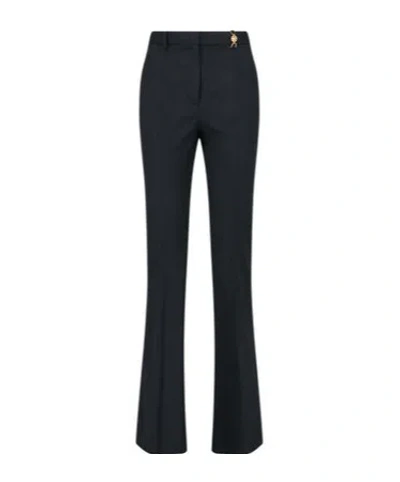 VERSACE VERSACE MEDUSA PLAQUE PLEATED TROUSERS