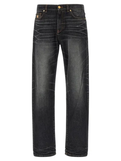 Versace Stonewashed Denim Jeans In Black