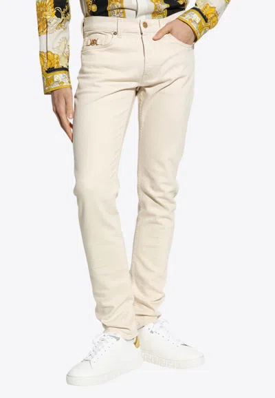 Versace Medusa Biggie Slim-fit Jeans In Neutral