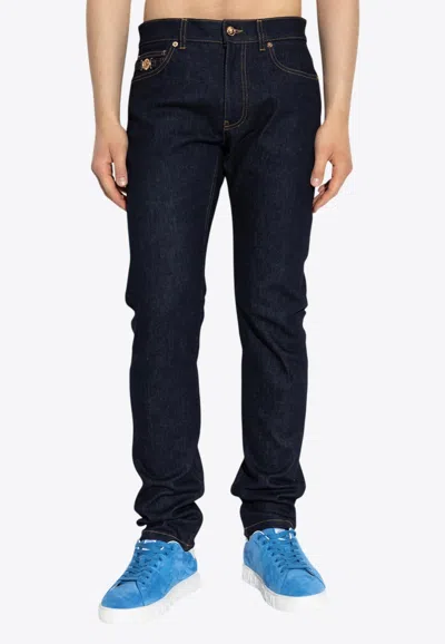 VERSACE MEDUSA SLIM-LEG JEANS