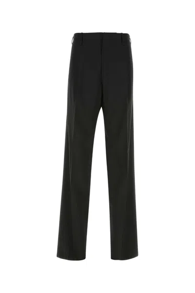 Versace Wool Elastane Trousers In Black