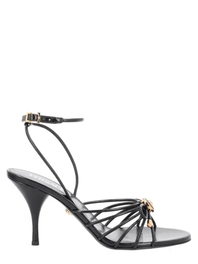Versace Opera Bow Gold-tone Emblem Sandals In Gray