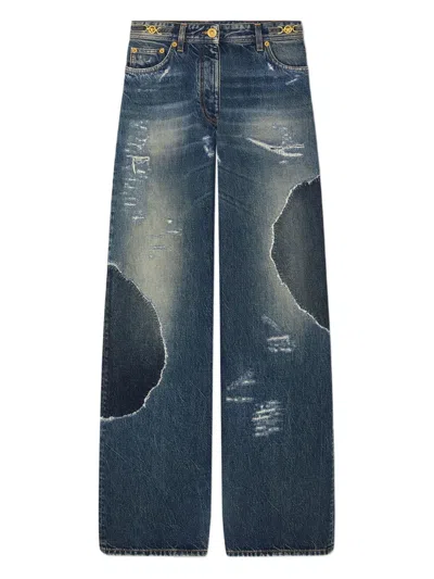 VERSACE PATCHWORK DISTRESSED-EFFECT JEANS