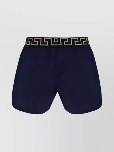Versace Patterned Waistband Swimshorts With Side Slits In Blue