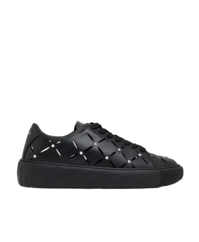 Versace Perforated Studded Sneakers In Black
