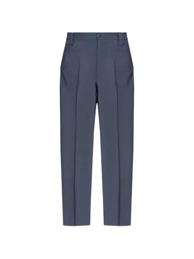 Versace Pressed-crease Trousers In Black