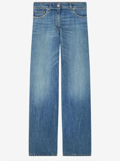 Versace Raw Cut Frayed Jeans In Black