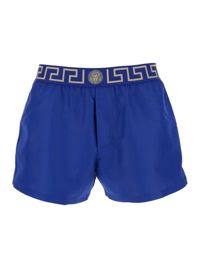 VERSACE BLUE SWIM SHORTS WITH ELASTIC WAIST WITH GRECA MOTIF IN TECH FABRIC MAN