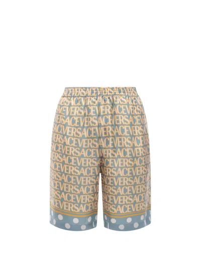 VERSACE SILK BERMUDA SHORTS WITH ALL-OVER LOGO