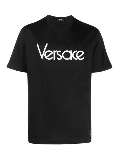 Versace Short-sleeve Cotton T-shirt With Bold Logo Print In Black
