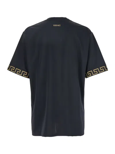 VERSACE BLACK CREWNECK T-SHIRT WITH GRECA PATTERN ON THE SLEEVES IN TECH FABRIC MAN