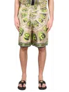 Versace Masks Knee Length Graphic Print Shorts In Acid Green Moonstruck