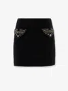 Versace Chic Fitted Mini Skirt With Embellished Pockets In Black
