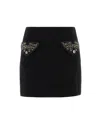 Versace Chic Fitted Mini Skirt With Embellished Pockets In Black