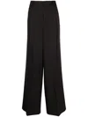 Versace Wide-leg Pleated Trousers In Schwarz
