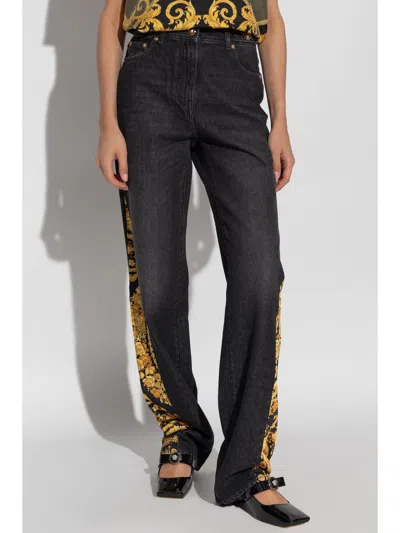 Versace Women Stone Wash Denim Pants With Print In 6d100 Black-multi