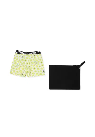 VERSACE YELLOW SWIM SHORTS FOR BABY BOY WITH FLORAL PRINT