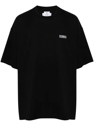 VETEMENTS BLACK COTTON T-SHIRT WITH EMBROIDERED LOGO